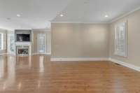 This space is considered the formal Dining Room and features recessed lighting and finished wood floors.