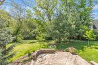 Lush Landscaped Grounds and Custom built Patio with seating.