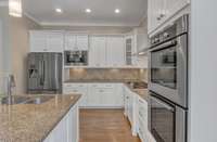 Alternate View of the Kitchen with tile backsplash and under cabinet lighting.