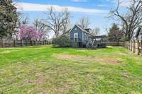 This fully fenced in backyard is huge. If you've been looking for a yard that will fit a pool- this is it.