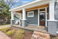 Front porch envy right here. The warmer weather is coming and this covered front porch ready for you.