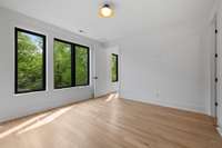 The fourth bedroom is quite large and has gorgeous windows and natural lighting.