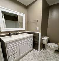 Large bathroom has been completely remodeled with new toilet, shower tub combo, new vanity, & floors. There is also a linen closet in the bathroom