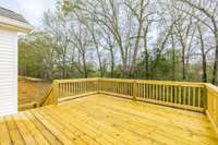 deck is oversized, perfect for enjoying this tree lined backyard