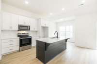 beautiful custom cabinetry with large island