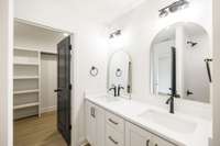primary bath has large double vanity with quartz countertop