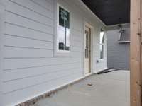 Rocking chair front porch with beadboard ceiling. (Note: photo taken prior to post installation)