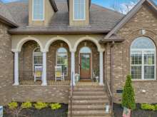 Who doesn't LOVE a rocking chair front porch!  This one gives privacy and views.