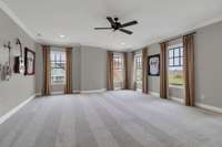 Large recreation room upstairs with plenty of natural light