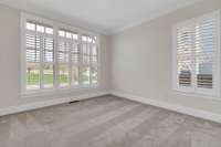 2nd Bedroom downstairs with en-suite bath and large walk in closet.  Can be used as office.  Plenty of natural light