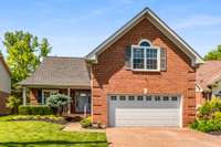 Very well manicured home and yard offering an aggregate driveway.