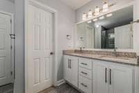 Double vanity and private toilet in master bathroom