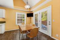 Another view of the eat-in area with easy access to the picturesque backyard.