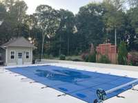 FRESHLY COATED POOL DECK