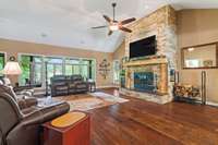 BEAUTIFUL LIVING ROOM WITH STONE FIREPLACE