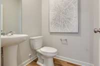 Convenient half bath on the first floor  Photo is of Welcome Home Center in another Lennar community. Finishes may vary.