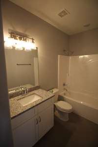 Secondary bath has linen closet! Tile floors! Granite Counter tops!