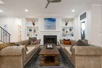 Gas Fireplace and custom built-ins add warmth to this light-filled room
