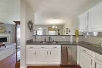 Kitchen opens up to living and dining area.