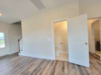 Half bath in the living room with laundry to the right.