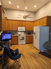 Plenty of cabinets for storage in this kitchen.