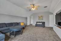 View from the front of the home, this bonus room features a large walk in closet. Possibly be used as a fourth bedroom?