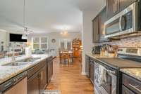 Granite counter tops and title backsplash to give a polished look