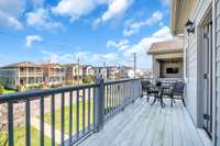 The balcony offers a beautiful front street view.