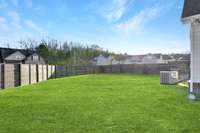 Large fully fenced side yard for your furry friends or privacy. Image has been enhanced.