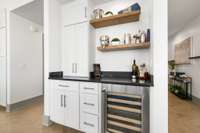 Built-in Dry Bar complete with wine fridge and upgraded shelving for all your entertaining needs