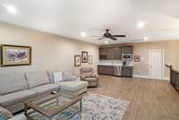 Bonus room with wet bar area with microwave and mini fridge