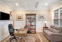 Study with coffered ceilings and wainscotting.