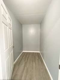 Primary bedroom walk -in closet