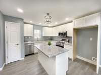 Bar seating at the island! Granite counters, pantry and abundant storage.