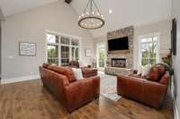 Living room with real Tennessee limestone fireplace and windows overlooking the back porch!