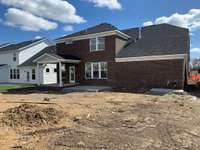 Actual Home Rear Exterior with a Covered Lanai (as of 4.20.24)