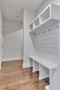 From the garage (door on left), a convenient drop zone/mud room that closes off from the main hallway with a pocket door.