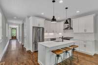 Beautiful open kitchen with an abundance of light and wired as part of the Sonos sound system for entertaining your guests with music!