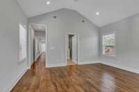 The spacious primary bathroom on the right leads into the large primary closet.