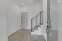 Polished concrete floors in entryway and throughout the ground floor.