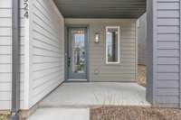 The covered front porch and fresh landscaping give this home excellent curb appeal