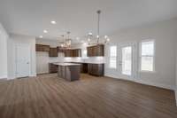 Kitchen opens to covered porch.