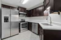 Beautiful, efficient kitchen. The refrigerator remains with the home so there's no need to buy one.