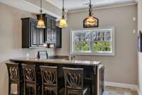 Cheers!!  This wet bar has a microwave, a drawer dishwasher and a mini-fridge!!