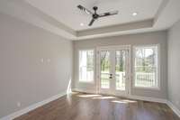 View of the primary bedroom from the bathroom.