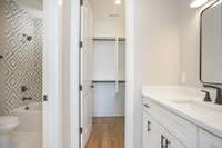 Bedroom 4 with its own vanity and walk in closet.