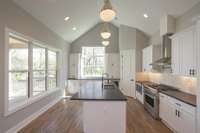 Excellent storage in this kitchen and TONS of natural light.