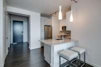 After stepping through the foyer, discover a spacious kitchen covered in light from the living room windows.