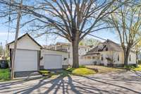 Two detached garage spaces face 49th Avenue.