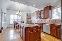 Kitchen opens to sunny breakfast area